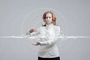 Woman making magic effect - flash lightning. The concept of electricity, high energy.