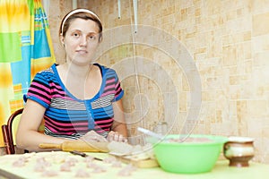 Woman making meat dumplings