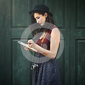 Woman Making Notes Outside City Concept