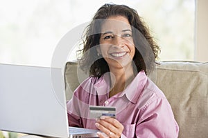 Woman making online purchase at home