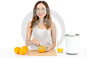 Woman making orange juice