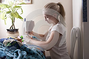 Woman Making Patchwork At Sewing Machine