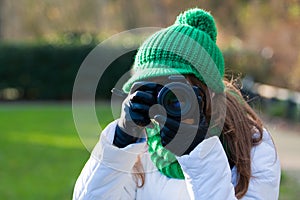 Woman making photo outdoor