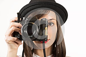 Woman making photos with vintage film camera