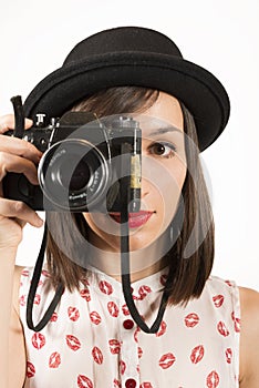 Woman making photos with vintage film camera