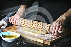 Woman making a pie from flaky pastry dough