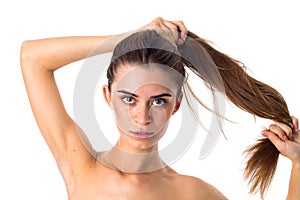 Woman making ponytail