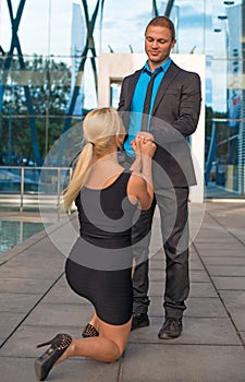 Woman making proposal to man.