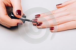 Woman making self manicure