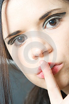 Woman making silence sign