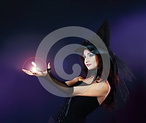 Woman making spell with magic fireball