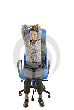 Woman making stretching moves while she is sitting on the office chair