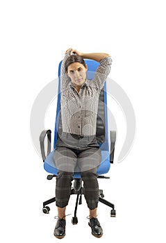 Woman making stretching moves while she is sitting on the office chair