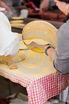 Woman Making talos, Tortilla than wraps txistorra. photo