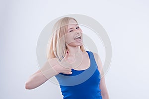 Woman making thumbs up gesture on white isolated background. Woman making sign ok, good with her hand