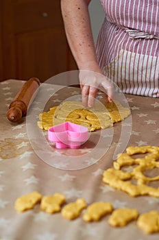 Woman making traditional cookiesat home