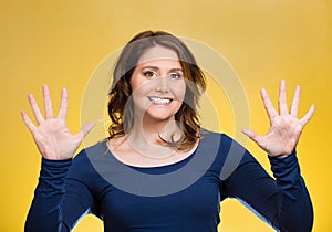 Woman making two times five sign gesture with hands, fingers, number ten