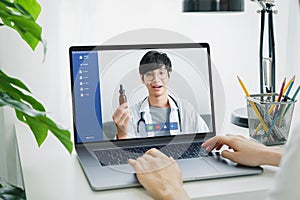 Woman making video call to doctor on laptop and provide help online counseling.