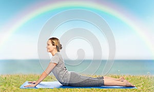 Woman making yoga in dog pose on mat