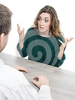 Woman and man in argument at a table