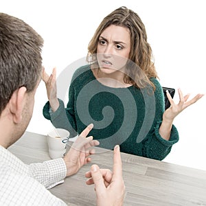 Woman and man in argument at a table