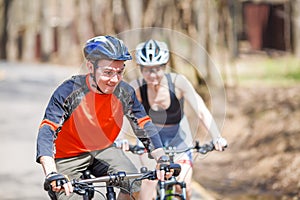 Woman , man on bike ride