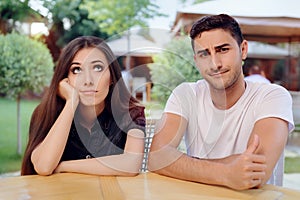 Woman and Man on a Boring Bad Date at the Restaurant