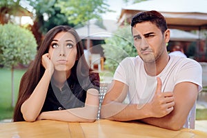 Woman and Man on a Boring Bad Date at the Restaurant