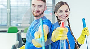 Woman and man in commercial cleaner team