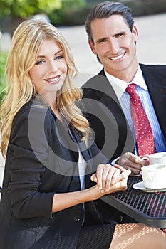 Woman & Man Couple Drinking Coffee At City Cafe