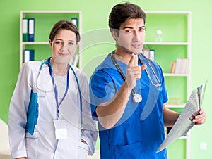 Woman and man doctors radiologists working at the clinic