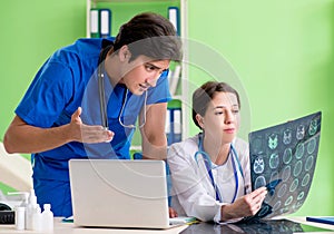 Woman and man doctors radiologists working at the clinic