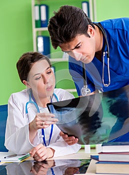 Woman and man doctors radiologists working at the clinic