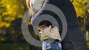 Woman and man embracing in autumn park, meeting after long time parting, love