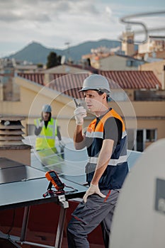 Woman and man engineer technicians doing maintenance service solar panel system