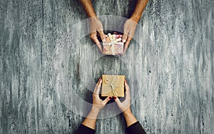 Woman and man exchanging gifts