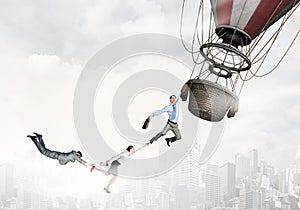 Woman and man flying on aerostat