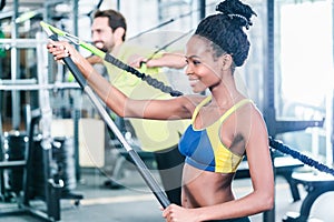 Woman and man in functional training for better fitness