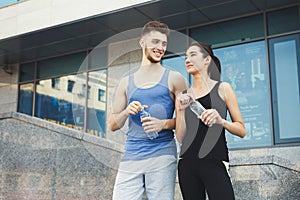 Woman and man is having break, drinking water