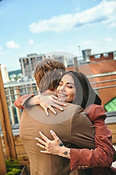 A woman and a man hugging