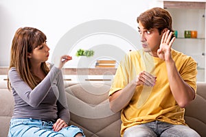 The woman and man learning sign language