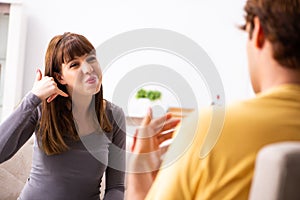 The woman and man learning sign language