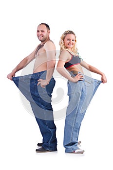 Woman and man loosing weight isolated on white