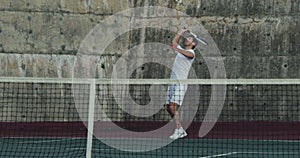 Woman and man playing tennis on a court