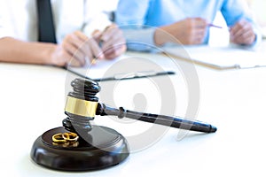 woman and man quarrel in front of gavel