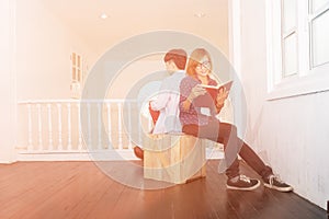 Woman and man reading book