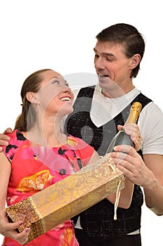 Woman and man rejoice the gift of expensive champagne