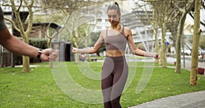 Woman, man or skipping rope jumping in workout, training or exercise in Boston city park or public garden. Fitness