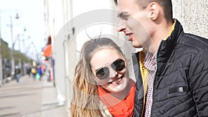 Woman and man standing on street