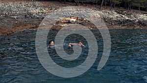 Woman and man swimming in the sea